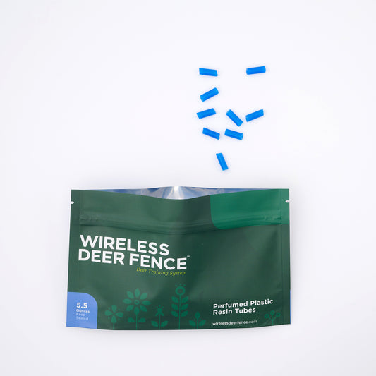 Green package of Wireless Deer Fence with blue resin tubes on a white background
