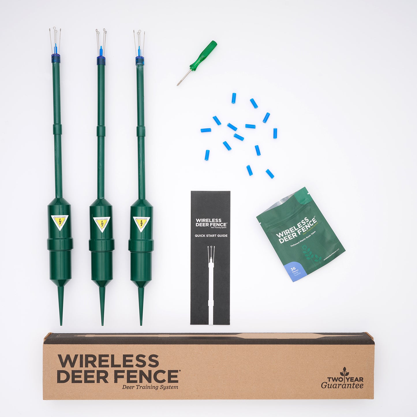 Wireless deer fence system with three green posts, a box, and instructional materials on a white background.